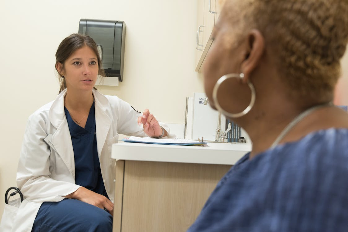 Woman having a check-up, representing the importance of medical supervision in addiction recovery.