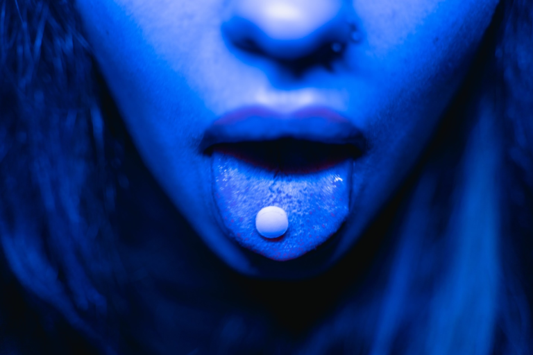 a person taking a pill