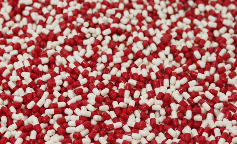 several red and white drug pills