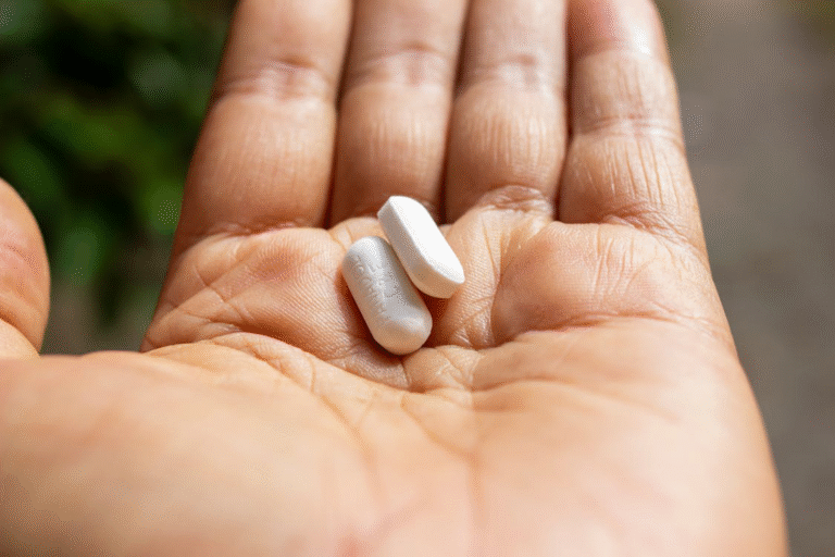 An image of a person holding pills in their hands