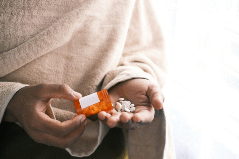 A person holding pills