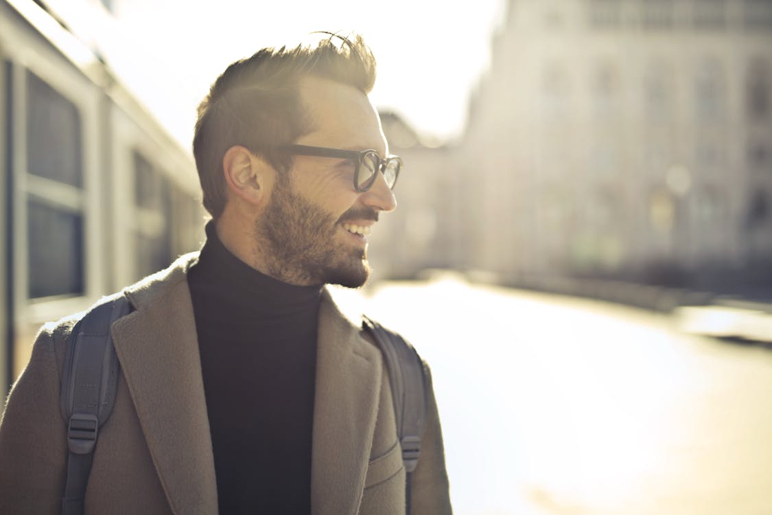 A happy man wearing eyeglasses