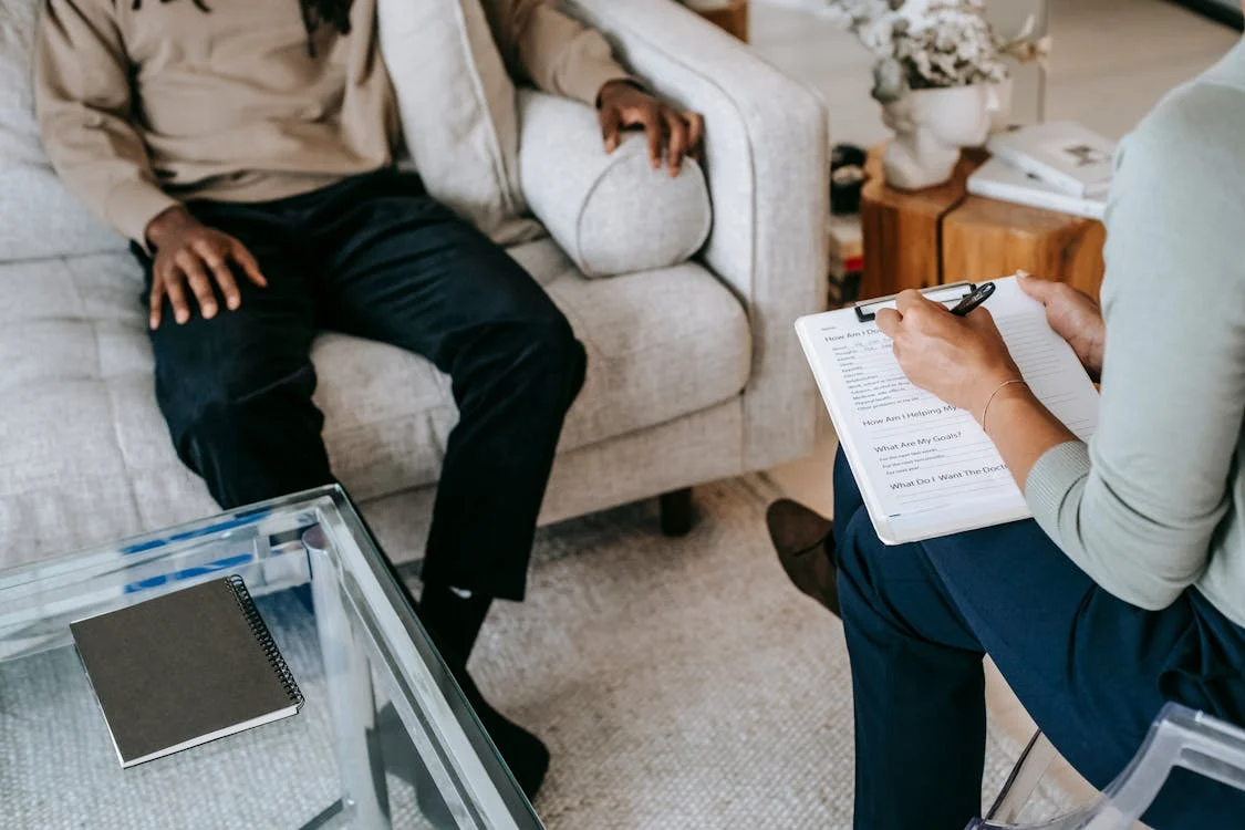 A person talking to a therapist