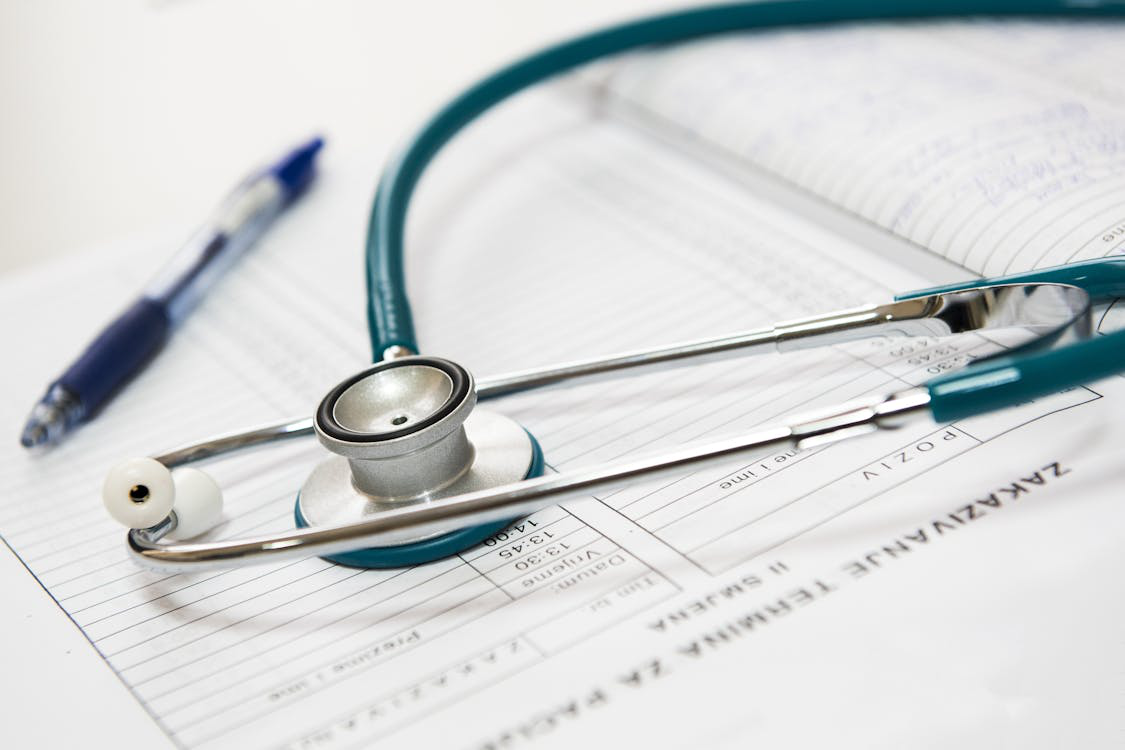 An image of a stethoscope and a pen