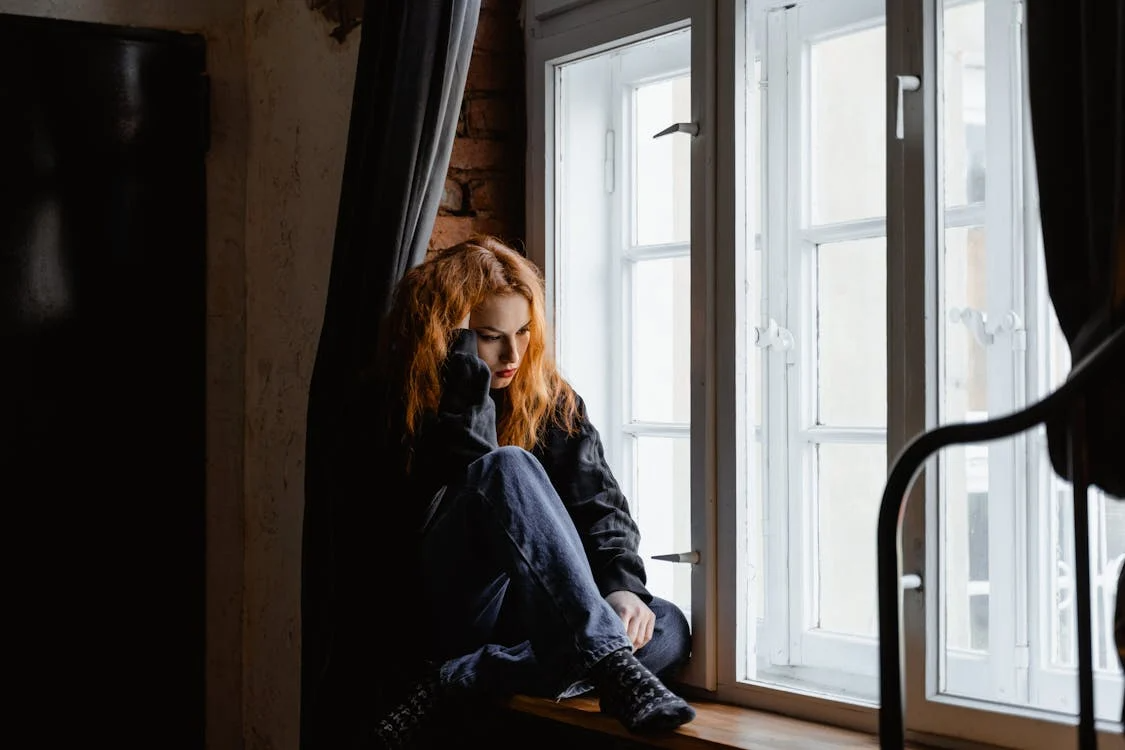A worried person brooding