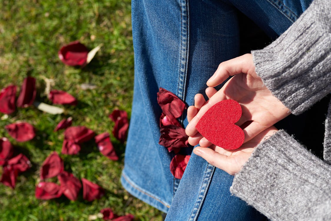 A person holding a heart