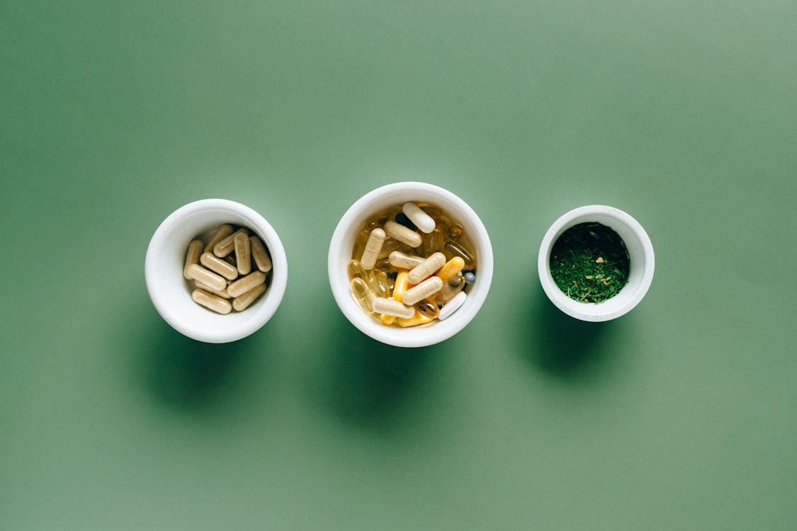 An image of pills in three different bowls    