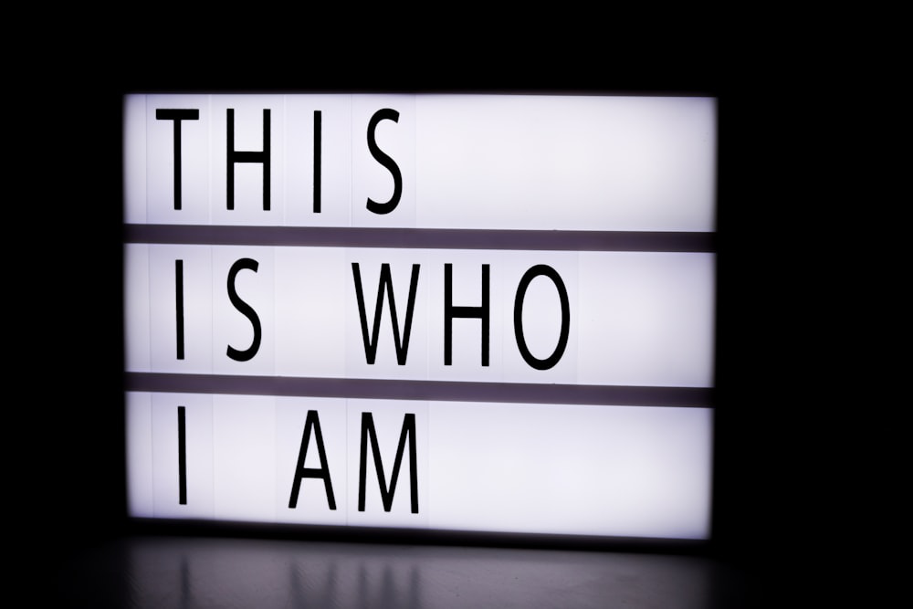 A lightbox sign displaying the message "This is who I am”.