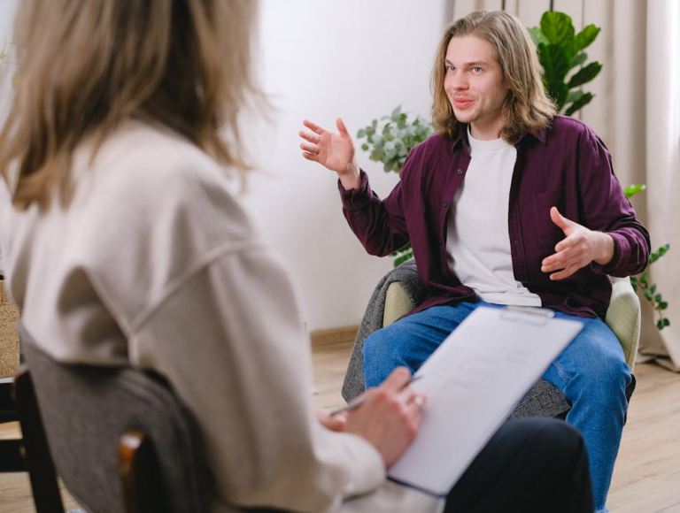 An image of a man talking to a therapist