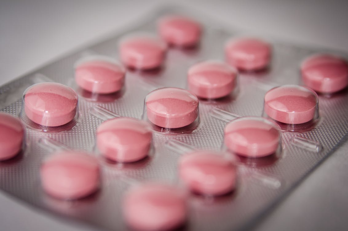 An image of a pack of pink pills