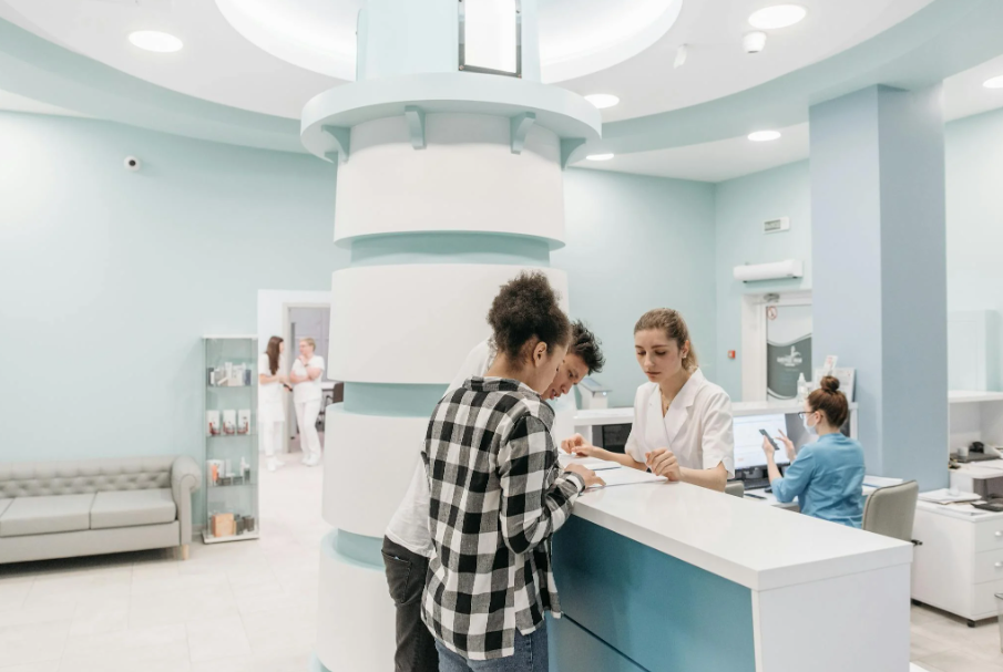 This image shows a couple during registration in a clinic.