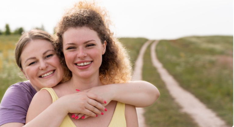 Happy women posing together and smiling in an outdoor setting