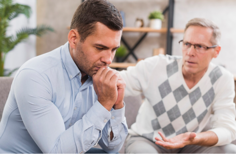 erson gently expressing concern to a loved one during discussion about addiction treatment