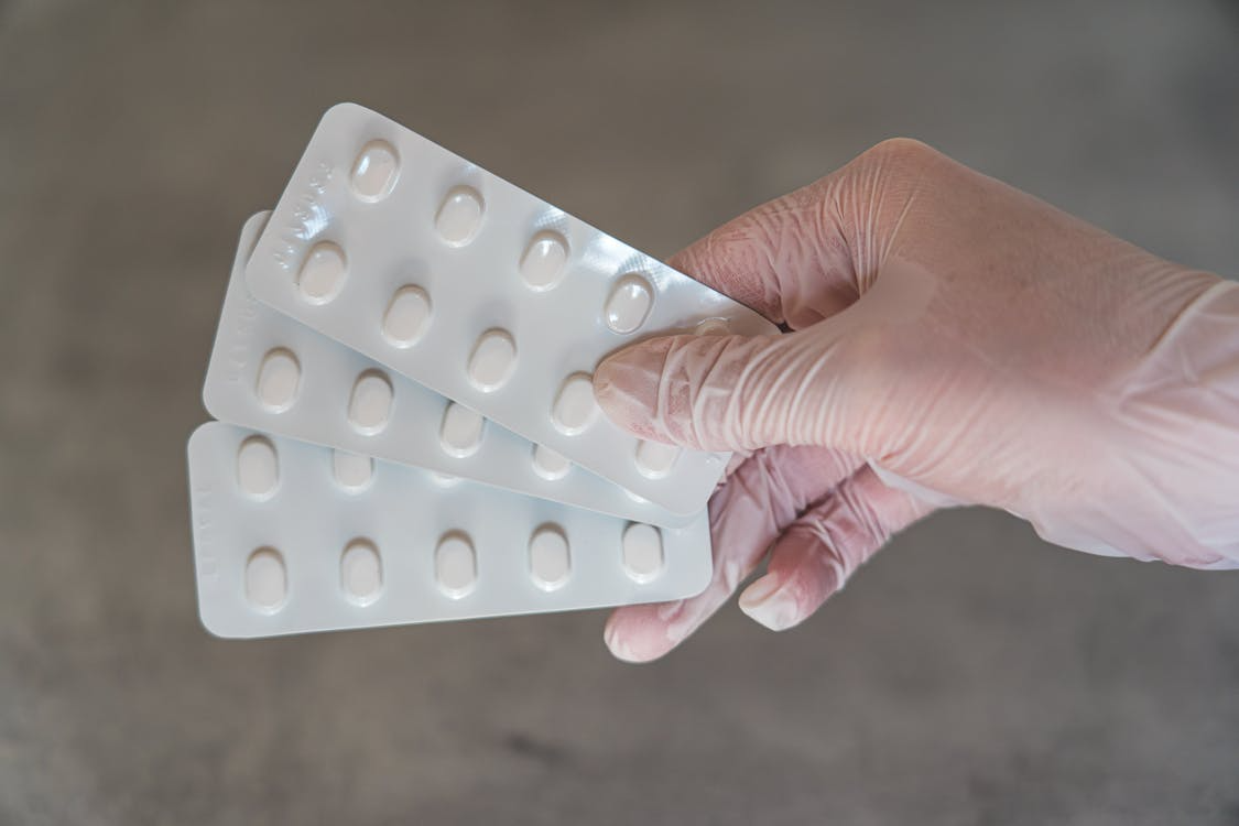 An image of pills in a person’s hand