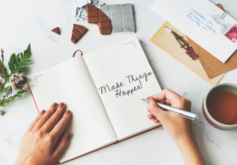 Person journaling as part of self-care routine for emotional well-being and reflection