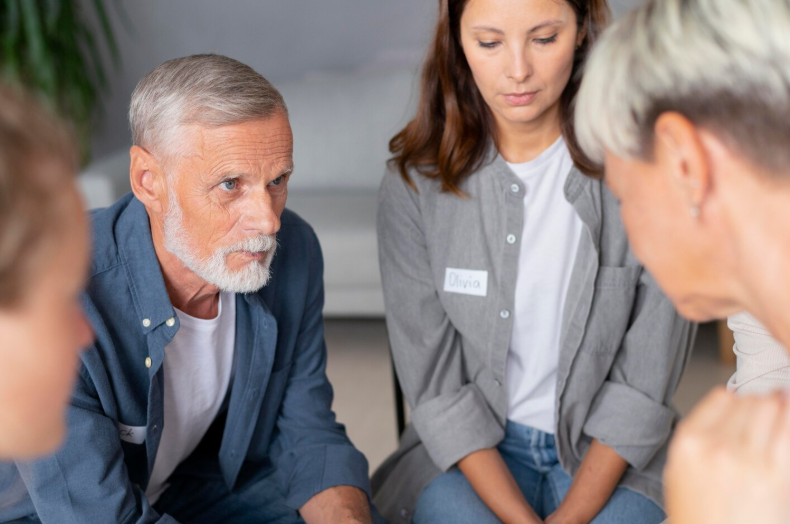Family observing with concern reflecting family awareness of addiction warning signs