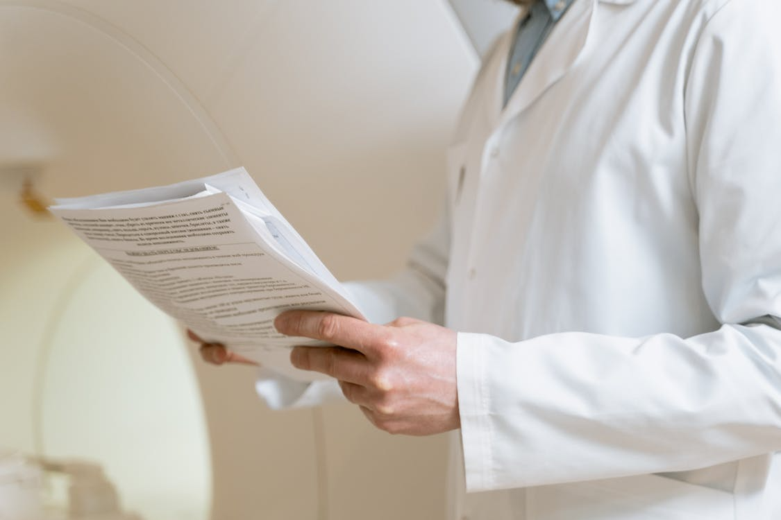 A professional going over medical documents