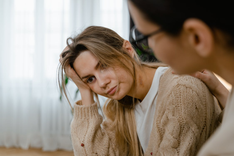 A woman in stress as another woman is comforting her