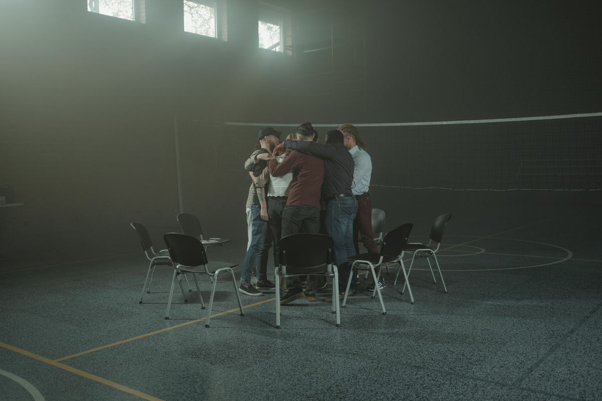 A group of friends sharing a supportive hug