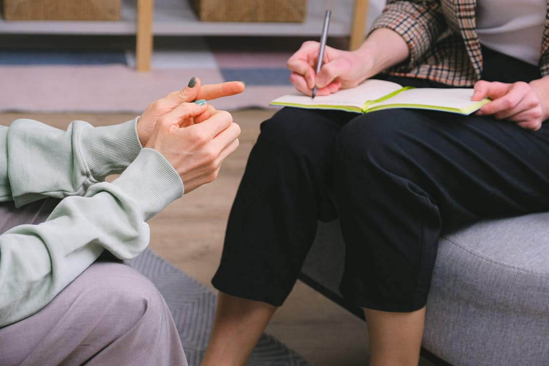 A woman is having an addiction counseling session