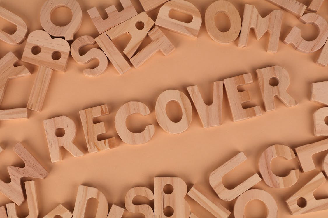 Recover written with wooden tiles