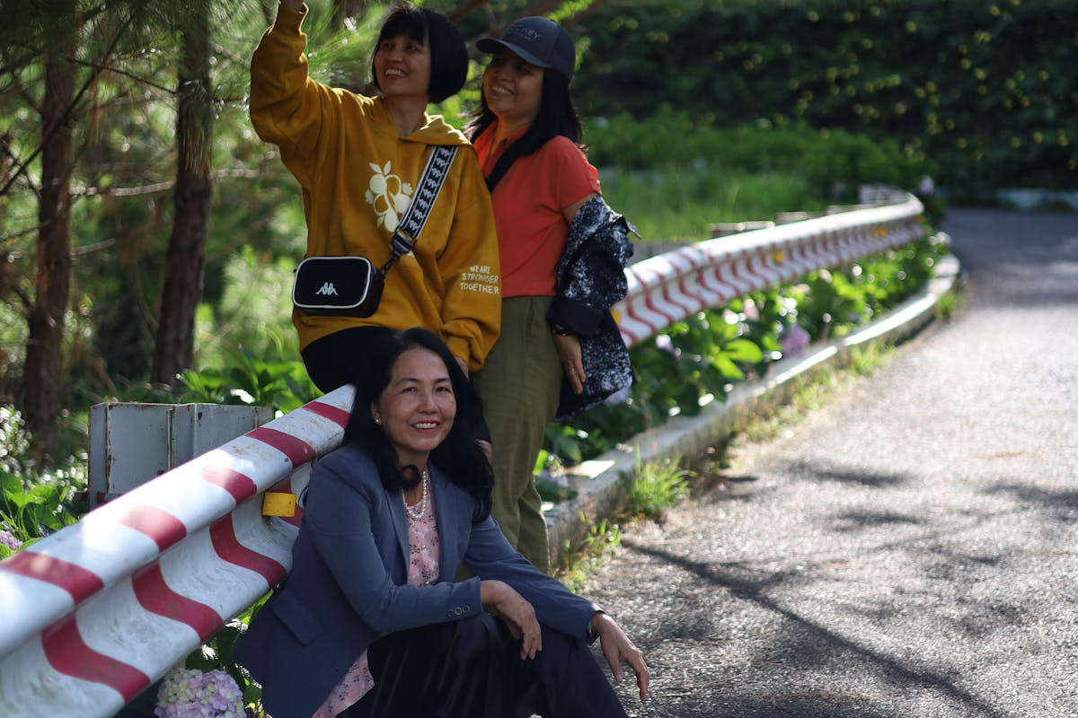 Friends smiling together outdoors on a sunny day