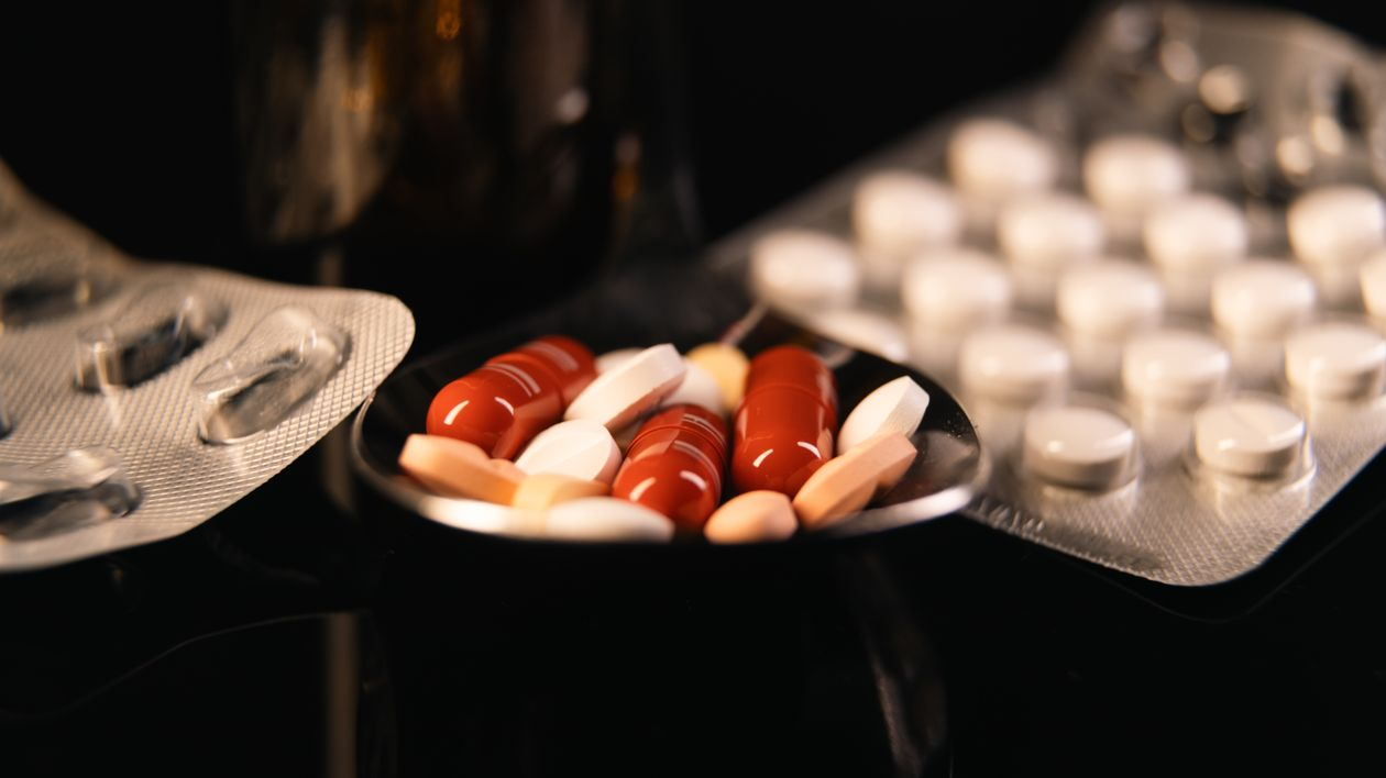An image of blister packs and pills in a small bowl