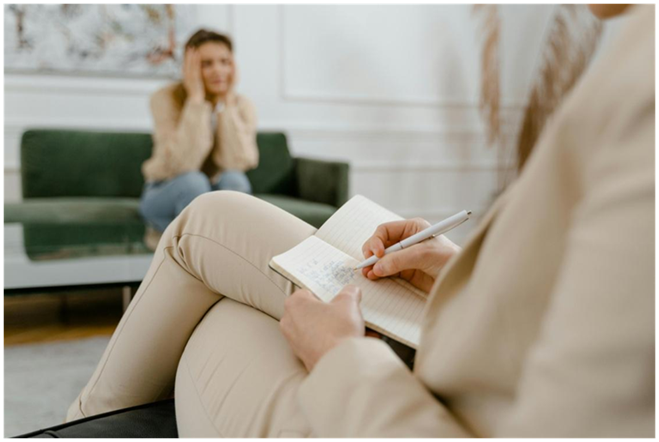 Therapist taking notes during a session